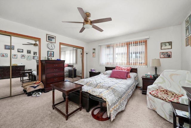 bedroom featuring ceiling fan and light carpet