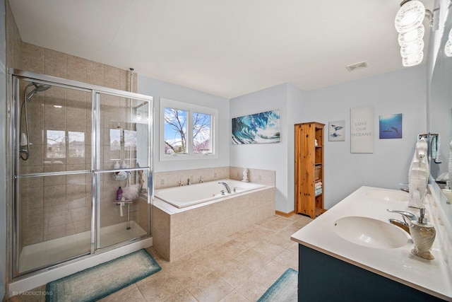 bathroom featuring vanity and independent shower and bath