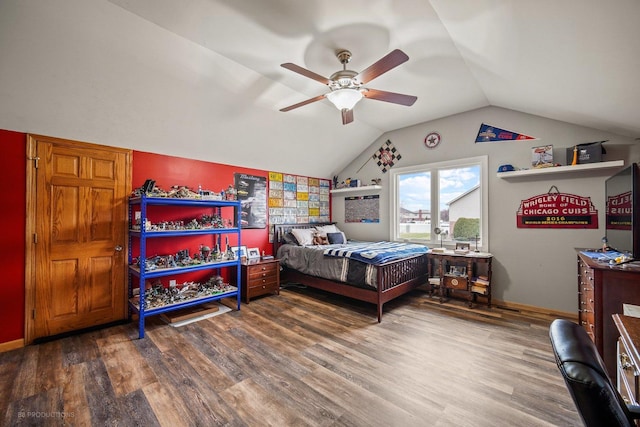 bedroom featuring lofted ceiling, hardwood / wood-style flooring, and ceiling fan