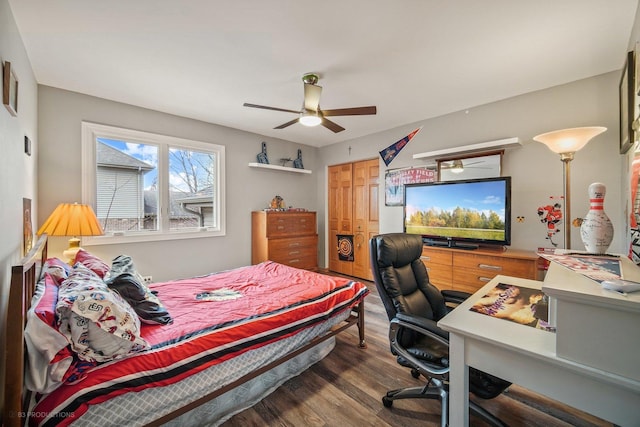 bedroom featuring a closet, ceiling fan, and dark wood-type flooring