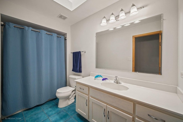 bathroom with vanity, toilet, tile patterned floors, and a shower with curtain