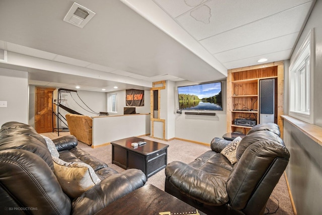 living room with built in features and carpet flooring