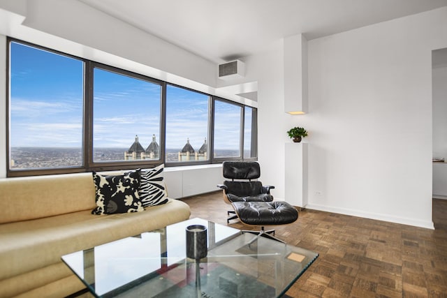 living room featuring dark parquet floors