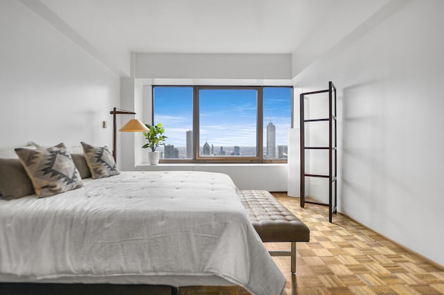 bedroom featuring light parquet floors