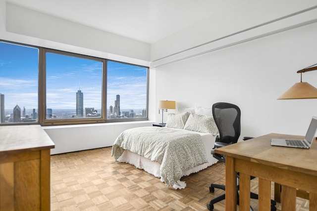 bedroom with light parquet floors