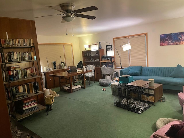 carpeted living room with ceiling fan