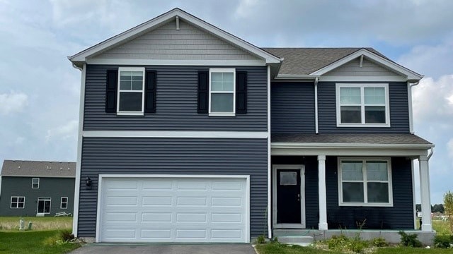 view of front of property with a garage