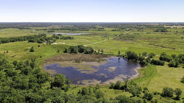 aerial view featuring a rural view and a water view