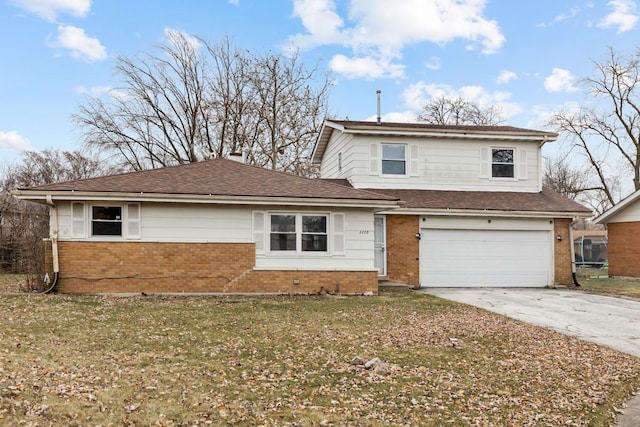 front facade with a front yard and a garage