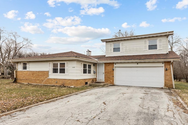 view of property with a garage and a front yard