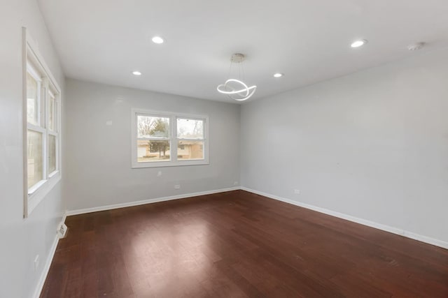 spare room featuring dark hardwood / wood-style floors