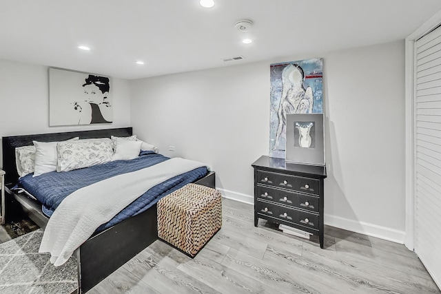 bedroom with light hardwood / wood-style floors