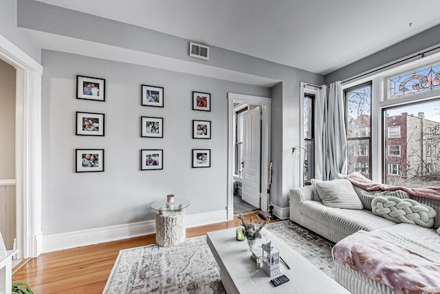 living room with light hardwood / wood-style flooring