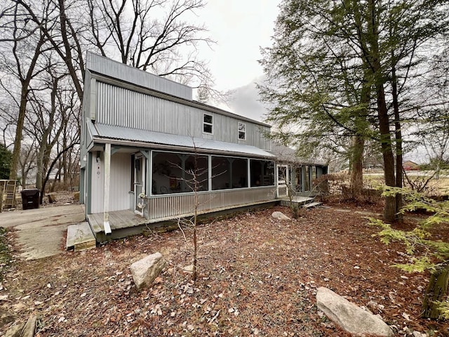 rear view of house with a sunroom