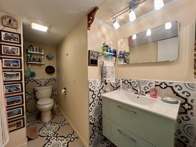 bathroom featuring vanity, a textured ceiling, tile walls, tile patterned flooring, and toilet