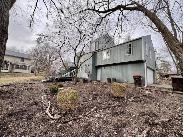 view of side of home with a garage