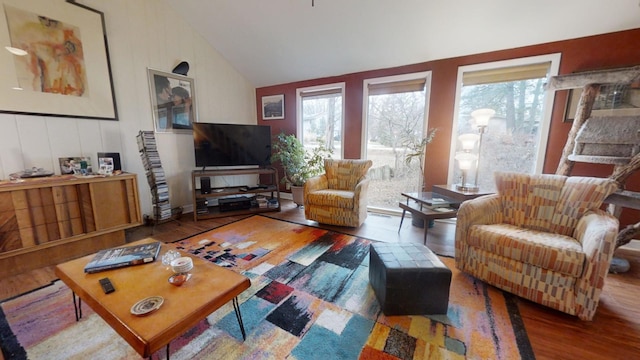 living room featuring hardwood / wood-style floors and lofted ceiling