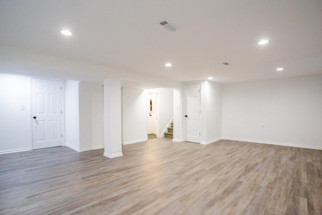 basement featuring light hardwood / wood-style floors