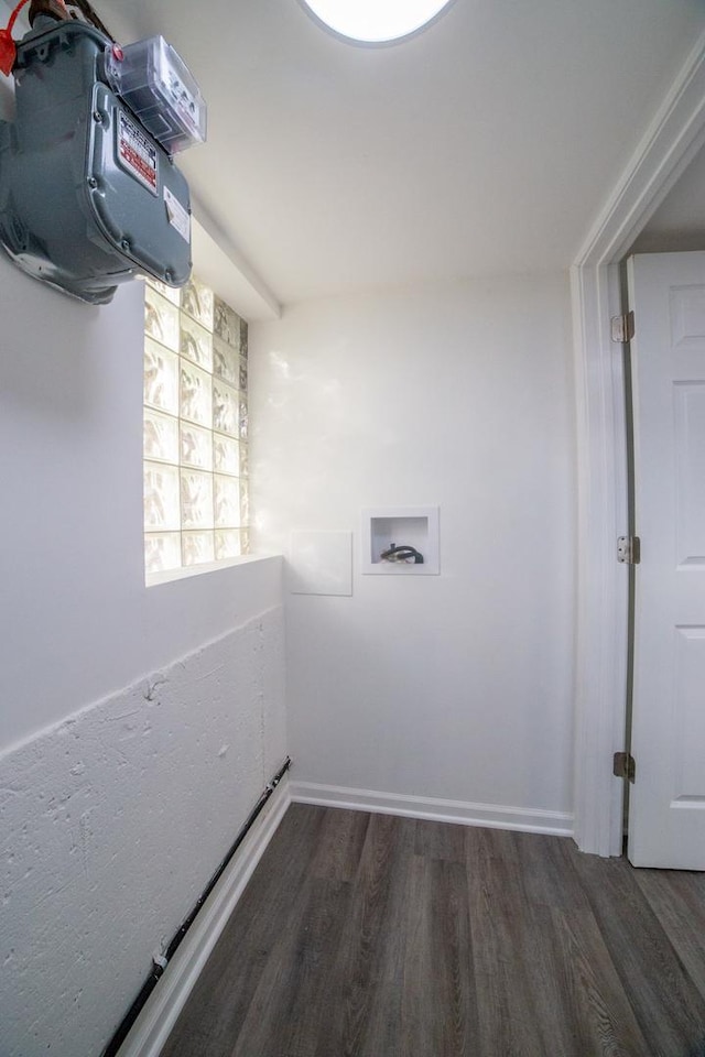 clothes washing area with hookup for a washing machine and dark hardwood / wood-style flooring