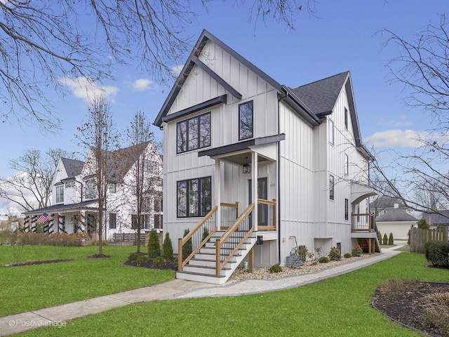 modern farmhouse style home with a front yard