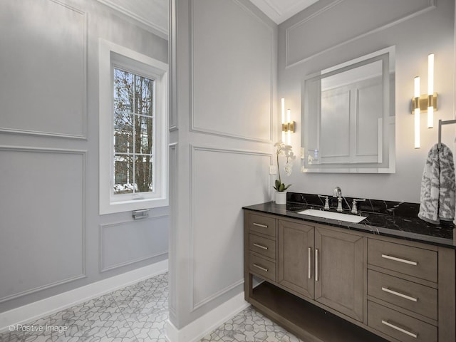 bathroom with ornamental molding, tile patterned flooring, and vanity