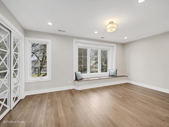 unfurnished room with light hardwood / wood-style floors