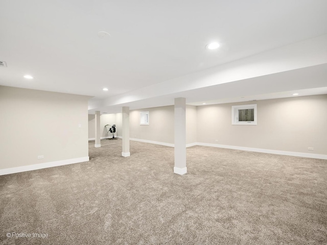 basement with light colored carpet