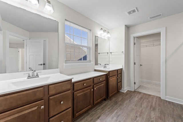 bathroom with vanity and hardwood / wood-style floors