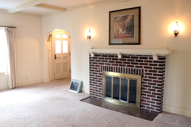 living room with beam ceiling, crown molding, a fireplace, and dark colored carpet