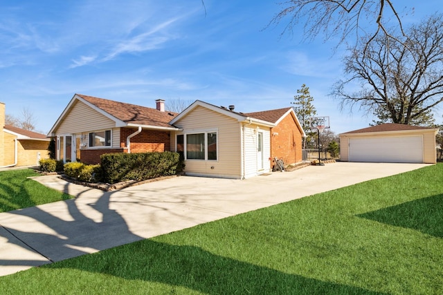 exterior space featuring an outdoor structure, a lawn, brick siding, and a detached garage