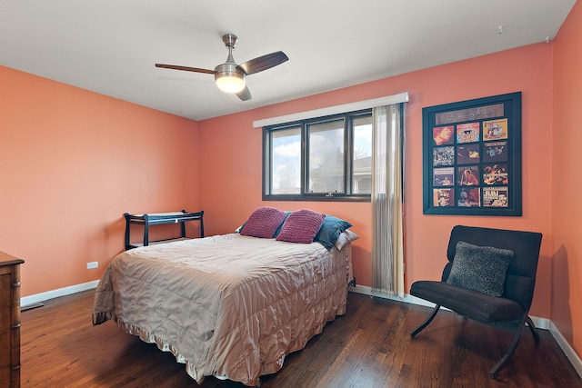 bedroom featuring ceiling fan and dark wood-type flooring