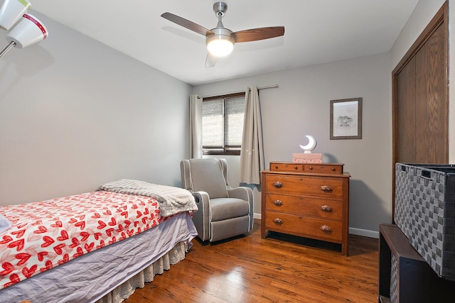 bedroom featuring ceiling fan and dark wood-type flooring