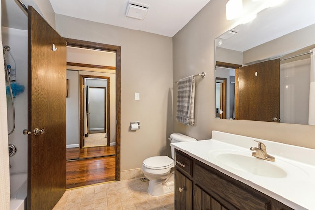 bathroom featuring vanity, toilet, and wood-type flooring