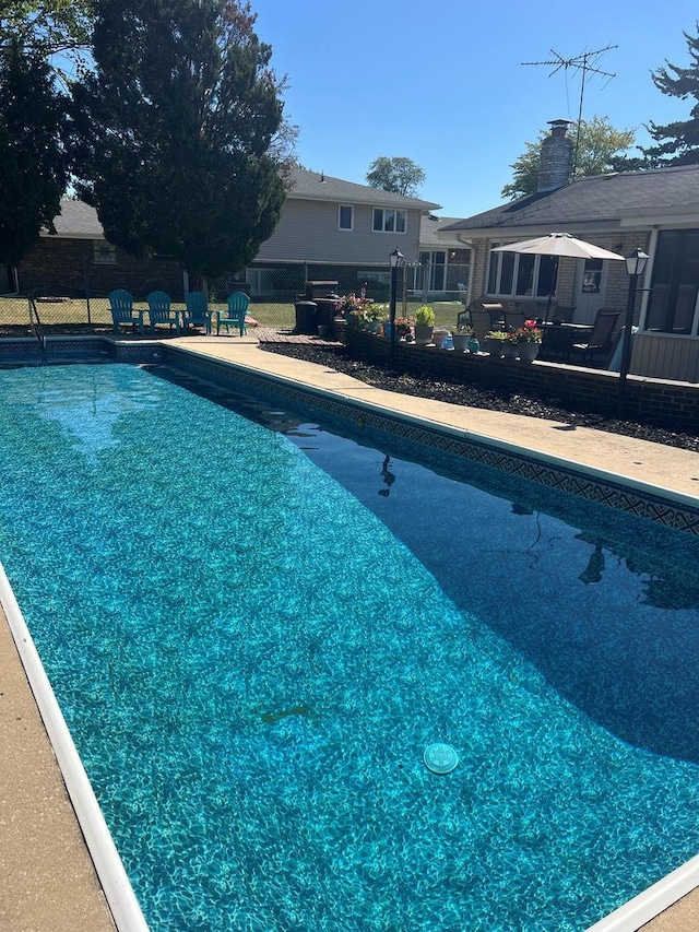 view of swimming pool featuring a patio area