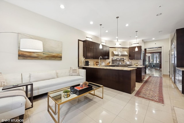 living room with light tile patterned flooring and sink