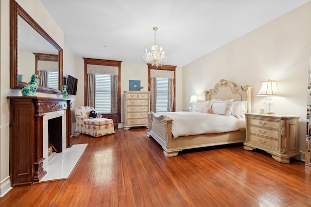 bedroom featuring a chandelier and hardwood / wood-style floors