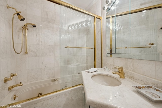 bathroom with vanity and bath / shower combo with glass door