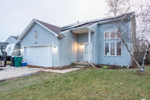 view of front facade with a garage and a front yard