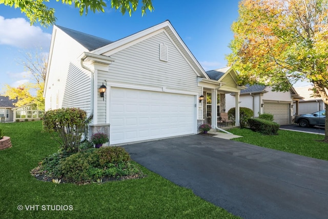 view of front of home featuring a garage and a front lawn