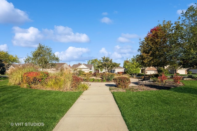 surrounding community with a lawn