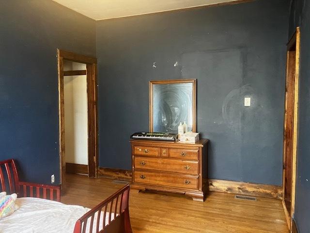 bedroom with light wood-type flooring