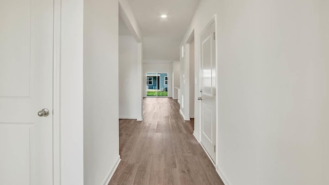 corridor featuring light hardwood / wood-style floors