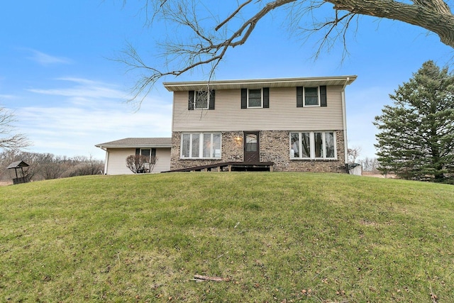 view of front of property with brick siding and a front yard