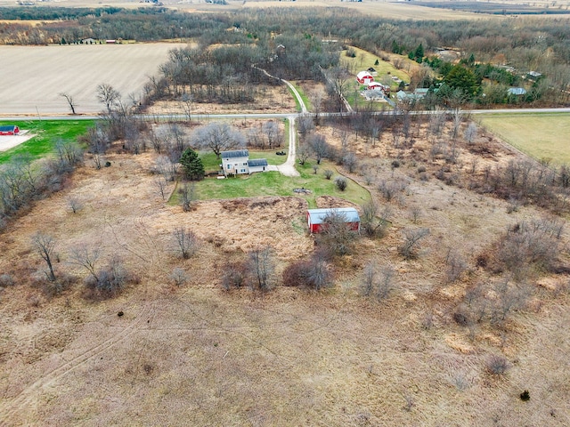 birds eye view of property featuring a rural view