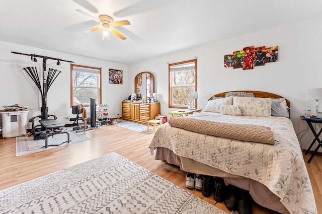 bedroom featuring ceiling fan and hardwood / wood-style flooring