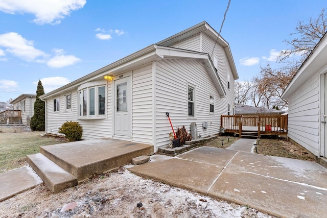 exterior space featuring a deck and a patio