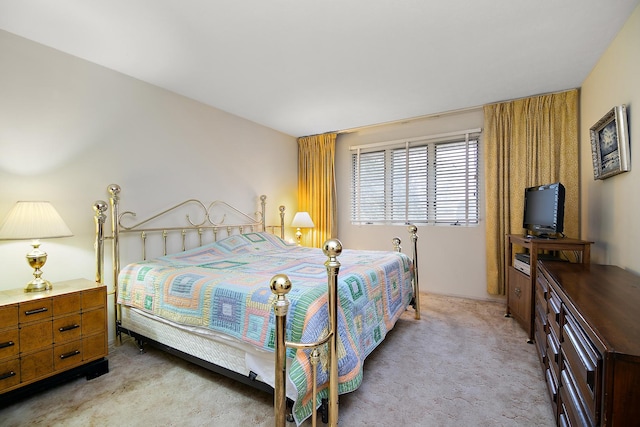 bedroom featuring light colored carpet