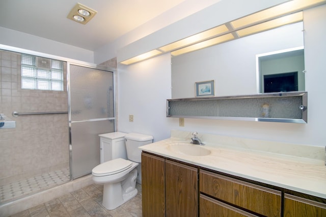 bathroom with vanity, toilet, and walk in shower