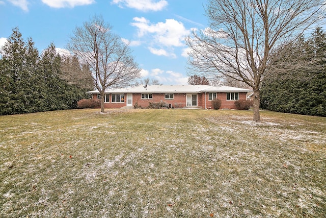 rear view of house with a lawn