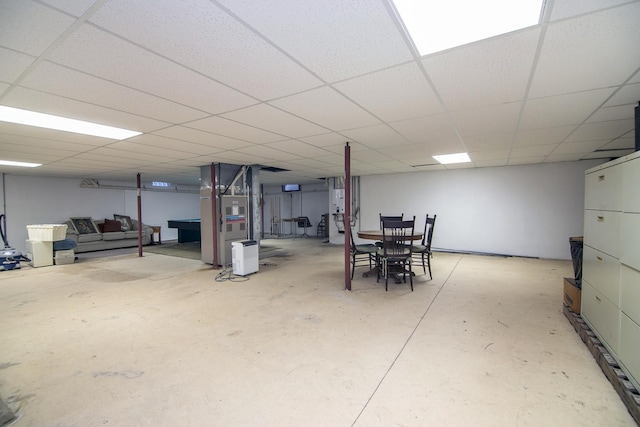 basement featuring a paneled ceiling